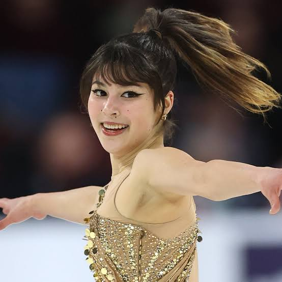 Alysa Liu performing on the ice during a figure-skating program.