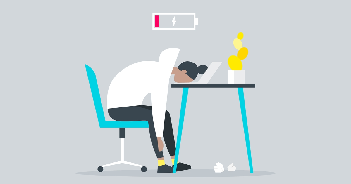 Illustration of an exhausted student slumped over a desk beneath a low battery symbol