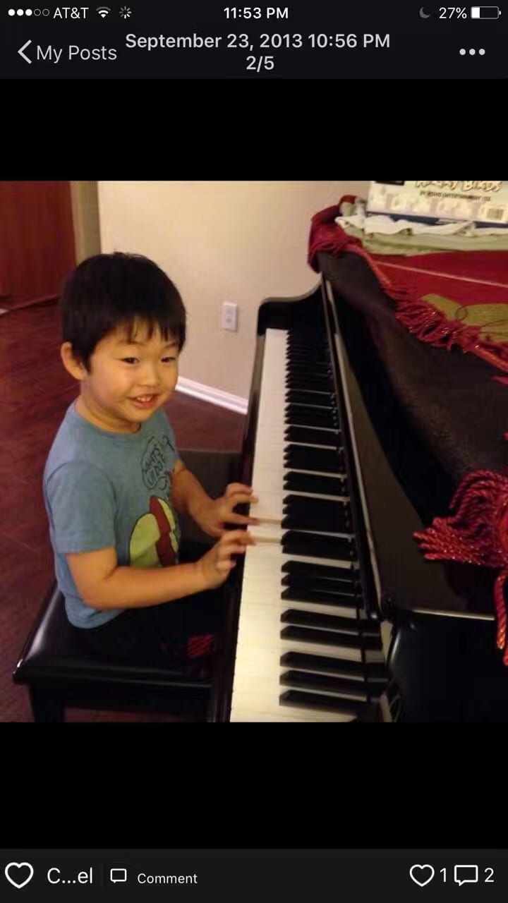 Jonathan Wang as a young child beginning piano lessons while sitting at a piano