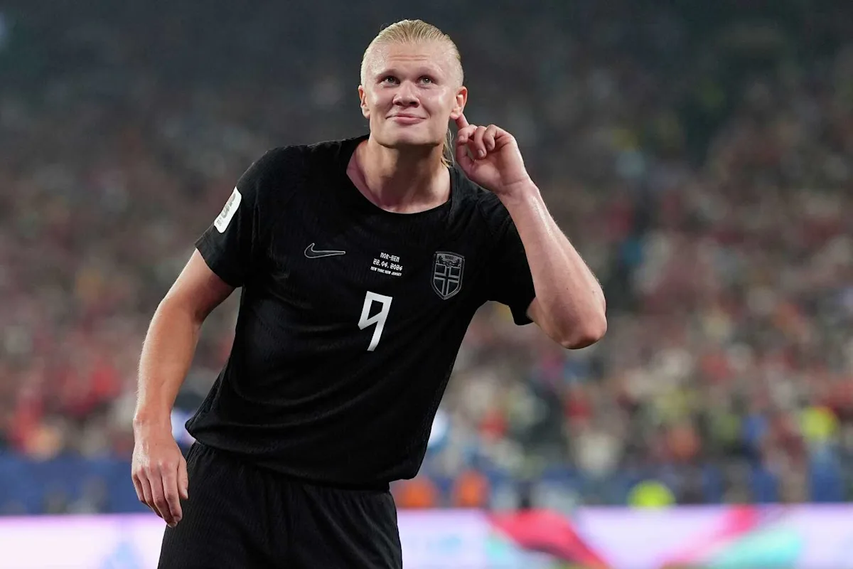 Erling Haaland celebrating on the pitch in a black Norway kit. Image taken from Yahoo Sports.