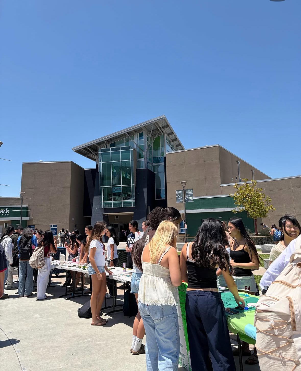 Students visiting wellness club tables outside Del Norte High School during the Mental Wellness Fair